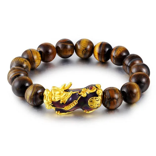 Tiger eye feng shui bracelet with gold pi xiu detail on a clean white background