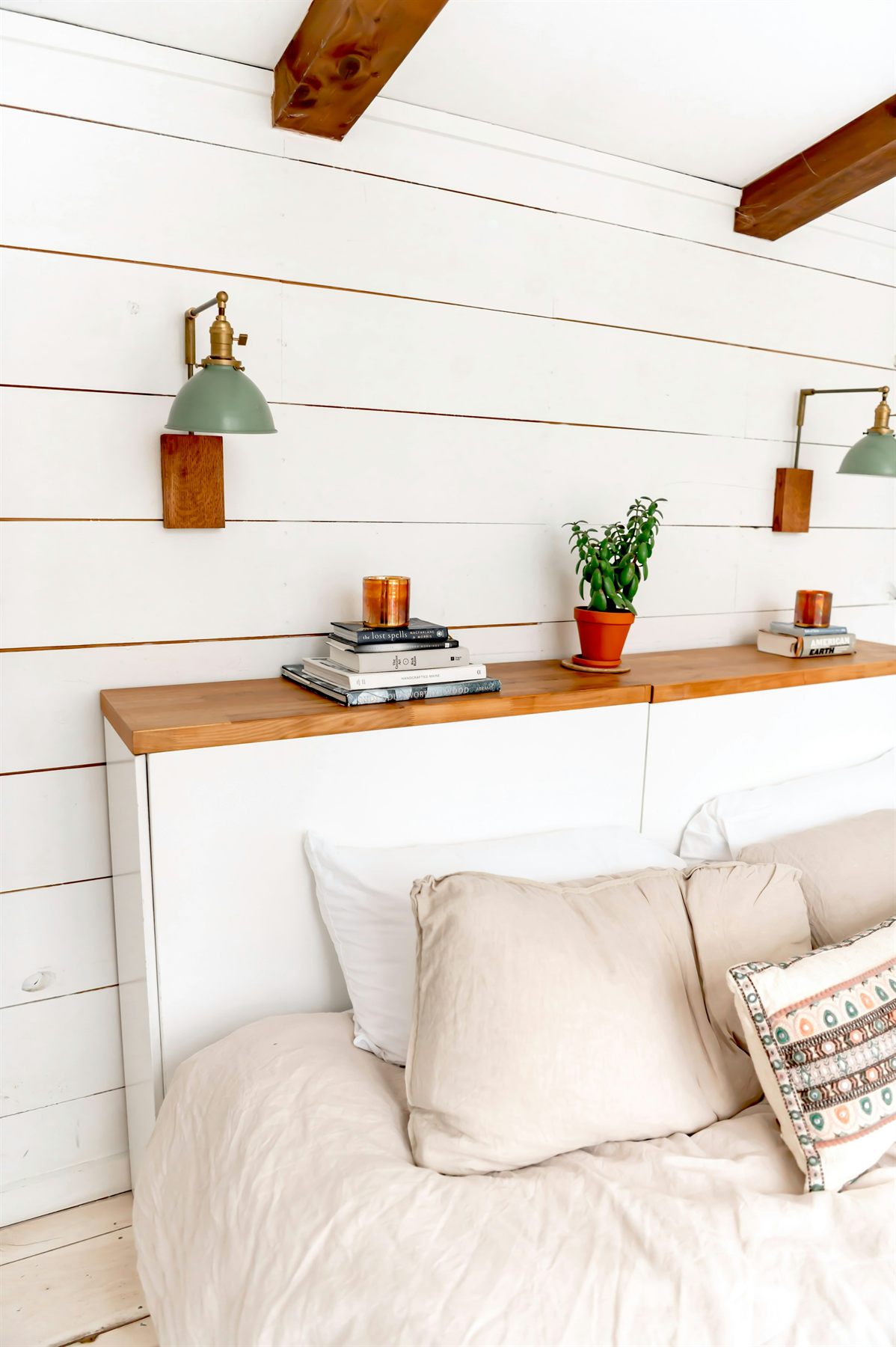 Bedroom with warm layered bedding and a gentler romantic palette