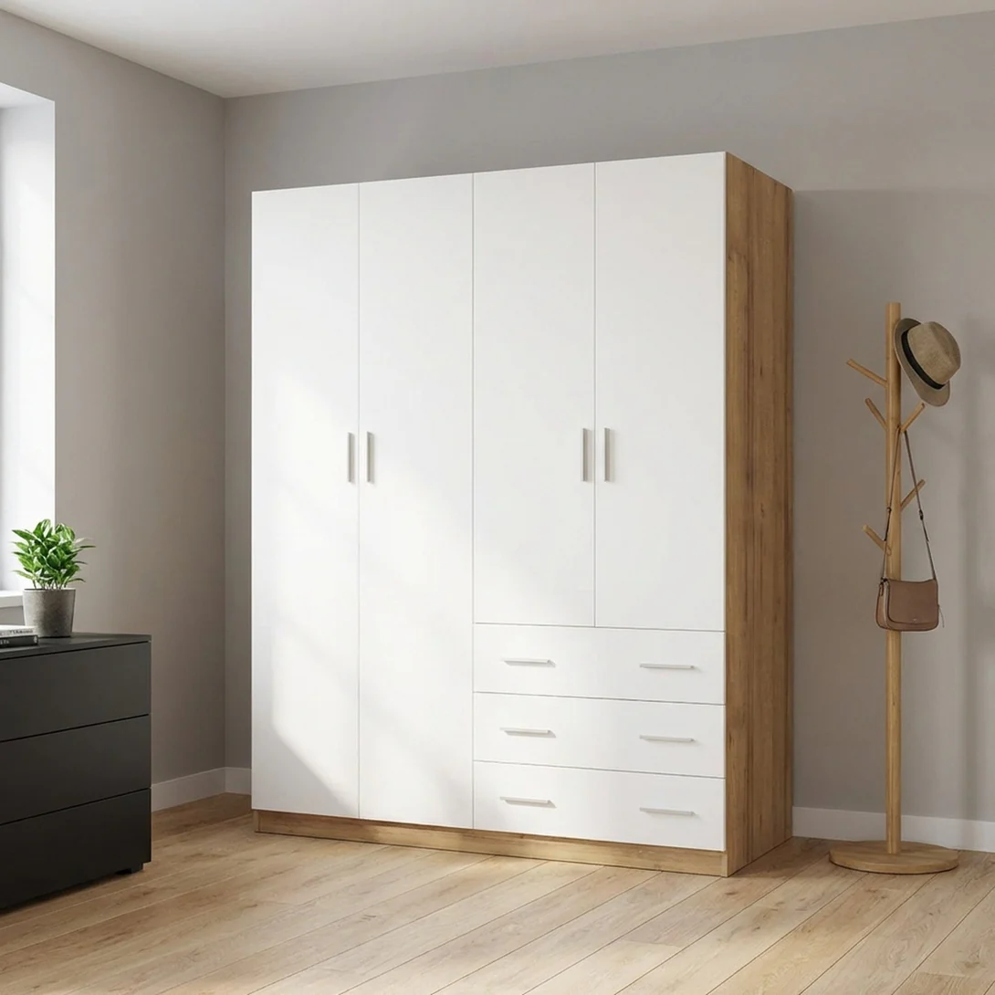 White and oak wardrobe with closed doors and lower drawers in a calm bedroom